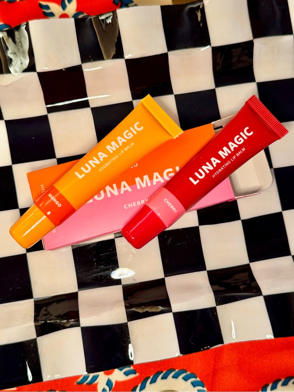 Mango LUNA MAGIC Hydrating Lip Balm Tubes in Orange and Red